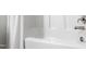 Bright, white bathtub and shower featuring brushed nickel fixtures and a white shower curtain at 139 Pronghorn Deer Ct, Garner, NC 27529