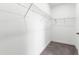 A walk-in closet with carpeted floors and white wire shelving for ample storage at 139 Pronghorn Deer Ct, Garner, NC 27529