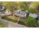 Captivating aerial view showcases a beautiful home with a meticulously landscaped yard and brick walkway at 1403 Wake Forest Rd, Raleigh, NC 27604