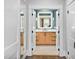 Modern bathroom with new fixtures and wood vanity at 1403 Wake Forest Rd, Raleigh, NC 27604