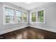 Bright room with hardwood floors and five large windows providing ample natural light at 1403 Wake Forest Rd, Raleigh, NC 27604