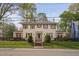 Beautiful home with wrought iron fence, manicured lawn, and charming curb appeal at 1403 Wake Forest Rd, Raleigh, NC 27604