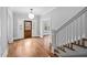Charming foyer with hardwood floors, bright natural light, and open staircase at 1403 Wake Forest Rd, Raleigh, NC 27604