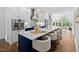 Modern kitchen with large island, stainless steel appliances, and ample seating at 1403 Wake Forest Rd, Raleigh, NC 27604
