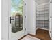 Walk-in pantry features open shelving, hardwood floors, and access to a beautiful courtyard with water feature at 1403 Wake Forest Rd, Raleigh, NC 27604