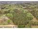 Beautiful wooded area with lake off in the distance at 15101 Aiken Rd, Wake Forest, NC 27587