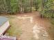 Aerial view of a wooded backyard with fence and tree line at 15101 Aiken Rd, Wake Forest, NC 27587