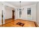 Elegant dining room featuring hardwood floors, chandelier, and large windows offering natural light at 15101 Aiken Rd, Wake Forest, NC 27587