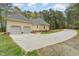 Home featuring large driveway leading to a two car garage at 15101 Aiken Rd, Wake Forest, NC 27587