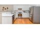 Modern kitchen featuring stainless steel appliances, white cabinetry, and a bright, functional design at 15101 Aiken Rd, Wake Forest, NC 27587