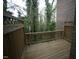 Back deck with wooden railing overlooking mature trees at 1523 Yarborough Park Drive, Raleigh, NC 27604