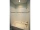 Bathroom featuring tiled shower over tub with chrome fittings and accent tiles at 1523 Yarborough Park Drive, Raleigh, NC 27604