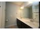 Bathroom with double sinks and a large mirror at 1523 Yarborough Park Drive, Raleigh, NC 27604