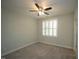 Neutral bedroom with carpet, ceiling fan and window fitted with shutter blinds at 1523 Yarborough Park Drive, Raleigh, NC 27604