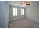 Bedroom with neutral carpet, a ceiling fan, and two windows at 1523 Yarborough Park Drive, Raleigh, NC 27604