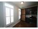A modern kitchen with dark wood cabinets, stainless steel appliances and hardwood floors at 1523 Yarborough Park Drive, Raleigh, NC 27604