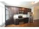 Kitchen with stainless steel appliances, granite countertops, and rich hardwood flooring at 1523 Yarborough Park Drive, Raleigh, NC 27604
