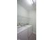 Laundry room with appliances and storage shelf at 1523 Yarborough Park Drive, Raleigh, NC 27604