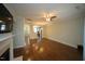 A living room featuring hardwood floors, a fireplace, and an open concept floorplan at 1523 Yarborough Park Drive, Raleigh, NC 27604