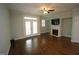 A living room featuring hardwood floors, a fireplace, and french doors at 1523 Yarborough Park Drive, Raleigh, NC 27604