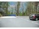 Parking lot with trash receptacles and a dark SUV parked in spot 1523 near lush landscaping at 1523 Yarborough Park Drive, Raleigh, NC 27604