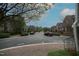 Street view showing lush landscaping, a wide street, and sidewalks surrounded by brick townhomes at 1523 Yarborough Park Drive, Raleigh, NC 27604