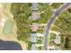Stunning aerial view of a home nestled between a golf course and a serene pond at 1525 Marshall Farm St, Wake Forest, NC 27587