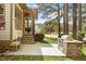 A stone bench, a brick outdoor kitchen, and a green lawn are the highlights of this backyard at 1525 Marshall Farm St, Wake Forest, NC 27587