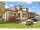The backyard features a stone bench, a brick outdoor kitchen, and a green lawn at 1525 Marshall Farm St, Wake Forest, NC 27587