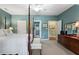 Bedroom with ensuite bath access, four-poster bed, and classic decor at 1525 Marshall Farm St, Wake Forest, NC 27587