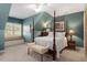 Bedroom featuring a window bench, four-poster bed, and custom decor at 1525 Marshall Farm St, Wake Forest, NC 27587