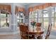 Breakfast nook with large windows, wood table and chairs, and natural light at 1525 Marshall Farm St, Wake Forest, NC 27587