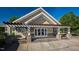 Beautiful clubhouse exterior showcasing a stone foundation, pergola, and a well-designed entrance at 1525 Marshall Farm St, Wake Forest, NC 27587