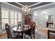 Dining area featuring shuttered windows and an elegant chandelier at 1525 Marshall Farm St, Wake Forest, NC 27587