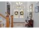 Elegant foyer with a chandelier, double doors, wood accents, and a staircase for a grand entrance at 1525 Marshall Farm St, Wake Forest, NC 27587