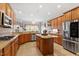 Spacious kitchen featuring granite countertops, island, stainless steel appliances, and ample cabinets at 1525 Marshall Farm St, Wake Forest, NC 27587