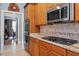 Kitchen featuring granite countertops, stainless steel appliances, and tile backsplash at 1525 Marshall Farm St, Wake Forest, NC 27587