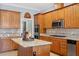 Open kitchen design with granite countertops, stainless appliances, and custom cabinetry at 1525 Marshall Farm St, Wake Forest, NC 27587