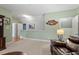 Spacious living room showcases plush carpeting, recessed lighting, and a plush leather sofa set at 1525 Marshall Farm St, Wake Forest, NC 27587