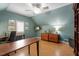 Home office featuring hardwood floors, a ceiling fan, and lots of natural light at 1525 Marshall Farm St, Wake Forest, NC 27587