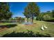 Scenic pond view with a gazebo, bridge, and lush landscaping creating a peaceful community setting at 1525 Marshall Farm St, Wake Forest, NC 27587
