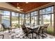 Relaxing sunroom features a ceiling fan, beautiful windows, and a dining table set at 1525 Marshall Farm St, Wake Forest, NC 27587