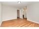 Spacious bedroom with vinyl floors, access to ensuite bath, and neutral colored walls at 1607 Willowcrest Rd, Durham, NC 27703