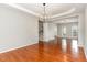 Elegant dining area with hardwood floors, chandelier, and seamless flow to living spaces at 1607 Willowcrest Rd, Durham, NC 27703