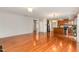 Open-concept living area with hardwood floors, connecting to kitchen and dining spaces at 1607 Willowcrest Rd, Durham, NC 27703