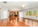 Bright, open-concept living room with hardwood floors and seamless flow to the kitchen at 1607 Willowcrest Rd, Durham, NC 27703