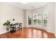 Office featuring hardwood floors, neutral walls, and a bright bay window at 1607 Willowcrest Rd, Durham, NC 27703
