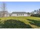 Expansive backyard showcasing a well-manicured lawn, privacy fence, and plenty of room for outdoor enjoyment at 1905 Maple Sugar Ln, Fuquay Varina, NC 27526