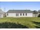 Well-maintained backyard with a patio area, lush green grass, and a privacy fence, great for entertaining at 1905 Maple Sugar Ln, Fuquay Varina, NC 27526