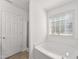 Bathroom featuring a soaking bathtub, tile floors, and a walk-in shower at 1905 Maple Sugar Ln, Fuquay Varina, NC 27526